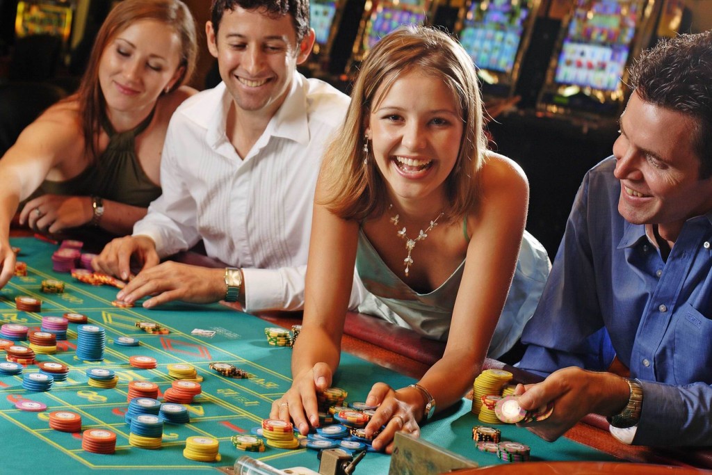 People playing on a roulette table
